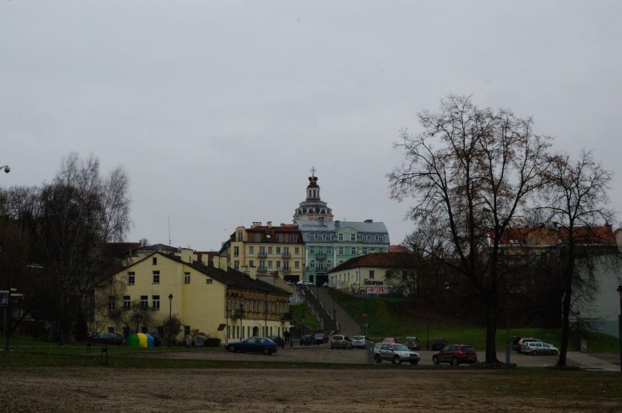 Church tower above historic buildings in Vilnius Old Town